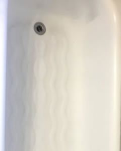 The same bath base white and clean after an end of tenancy clean